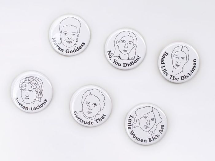 A set of feminist buttons from a brand that gives back to women with every purchase