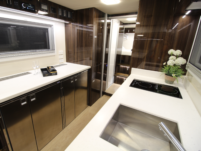 ... as well as a fully functional kitchen with a double burner stovetop, two microwave ovens, and two fridges.