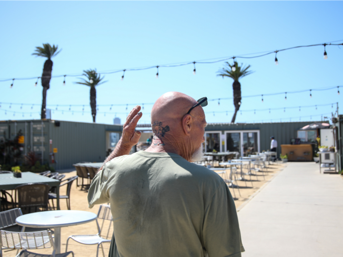 He volunteers at a food bank on the island and works as a dishwasher at Mersea, a restaurant and bar operating out of a shipping container along the waterfront.