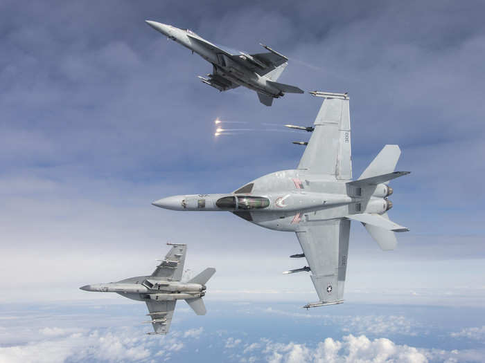 Three F/A-18E Super Hornets assigned to the Knighthawks of Strike Fighter Squadron (VFA) 136 from Naval Air Station (NAS) Lemoore flown fly in formation over the Sea Test Range in the Pacific Ocean on March 7, 2019 after completing a training mission.