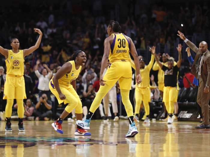 Los Angeles Sparks forward Nneka Ogwumike celebrates a basket against the Connecticut Sun with guard Chelsea Gray.