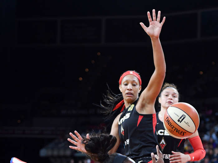 Chelsea Gray of the Los Angeles Sparks takes a diving shot after getting fouled by Las Vegas Aces star A