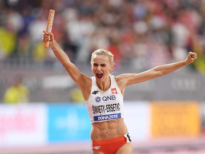 Justyna Święty-Ersetic of Poland celebrates winning silver in the Women