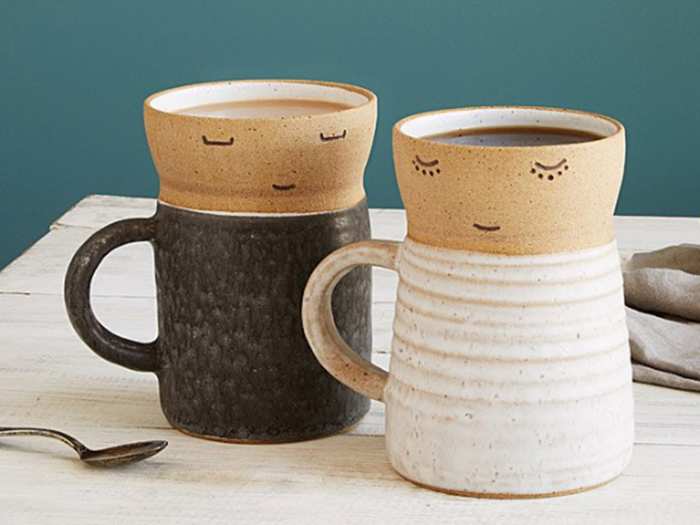 A pair of coffee mugs with an open mind