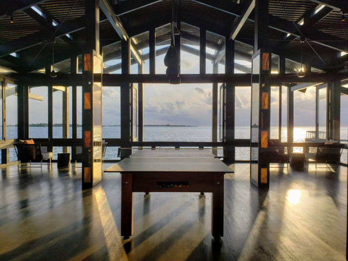 The Retreat has stunning architecture and features a second-floor recreation area with vaulted ceiling and sweeping views solely dedicated to a ping-pong table (which converts into a pool table).