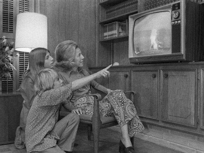 The Evans family watched two of the astronauts explore the moon on TV, while Ronald Evans orbited the moon in the command module.