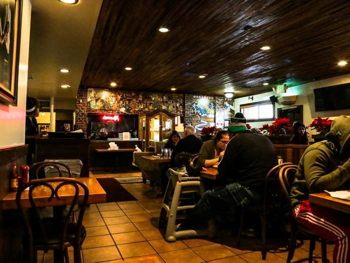 I was led inside to the large back dining room, a comfortable space with dim lighting and dark wood paneling.