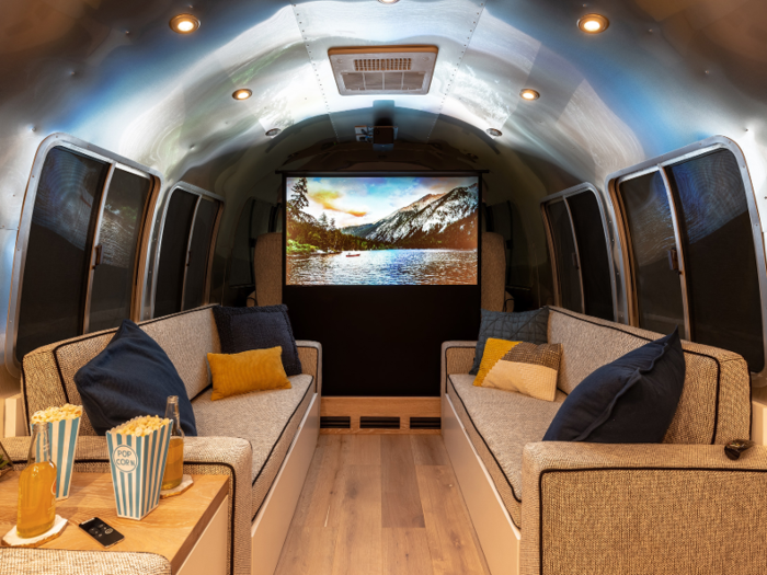 Loretta also includes amenities such as a home theater set-up: a pop-up projection screen and projector.