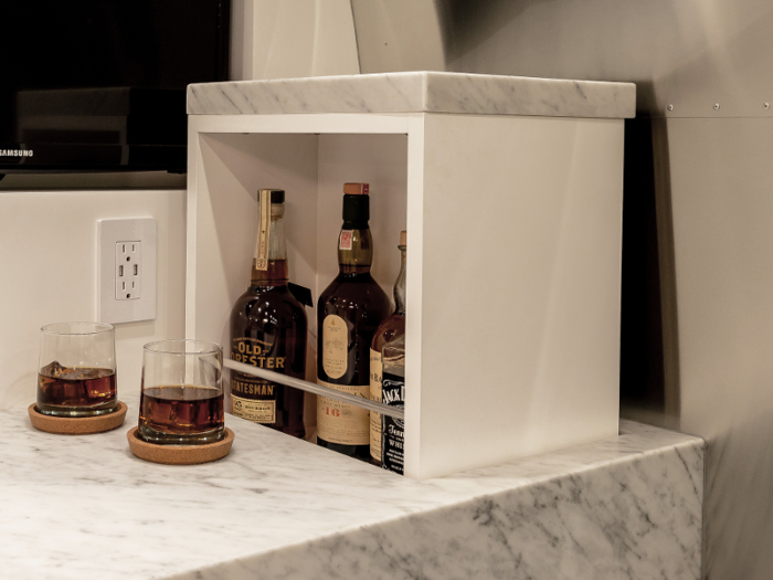 ...and a hidden liquor storage unit that can lift up from the bar-top.