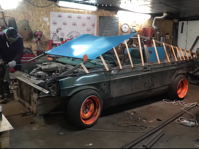 The YouTubers spent only 80,000 rubles (around $1,300) to create their Cybertruck replica. They covered the car in sheet metal, and spray-painted it a metallic hue to give their car the same futuristic look.