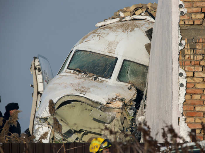 The plane "lost altitude during takeoff and broke through a concrete fence," Kazakhstan