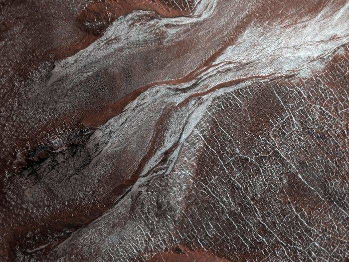 Sometimes, conditions on Mars lead frost to form, just like some chilly mornings on Earth. The Mars Reconnaissance Orbiter captured this shot of white frost on the planet