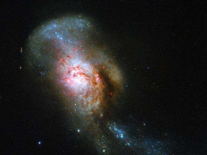 Such galactic pairs eventually merge into one giant galaxy, like this one Hubble captured in October.