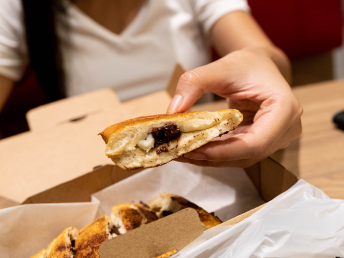 Pizza Hut Dubai has Chocomania: pizza dough with white and dark chocolate inside and cinnamon sugar on top. It was "scrumptious," aside from the end pieces, which had less chocolate in them, Business Insider reviewers found in 2018.