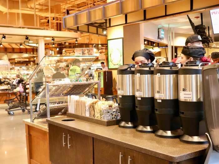 At this Wegmans, a coffee station at the front of store awaited weary travelers — or any shopper in need of a pick-me-up.