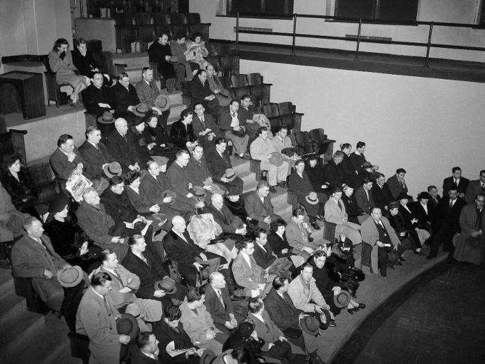 Friends and relatives of missing people filled an amphitheater at a mortuary as they waited to try and identify victims.