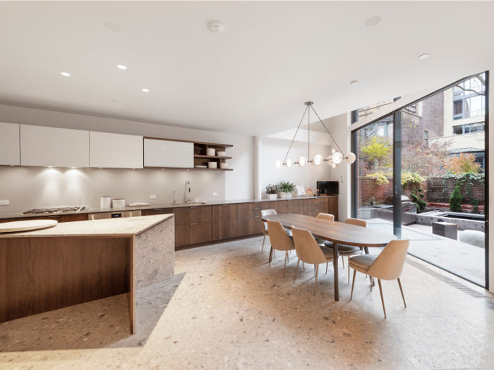 The kitchen opens up to the back garden and terrace.