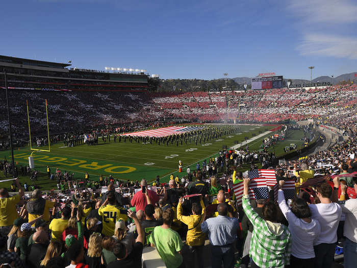 The stadium transformed into a sea of stars and stripes during the national anthem.