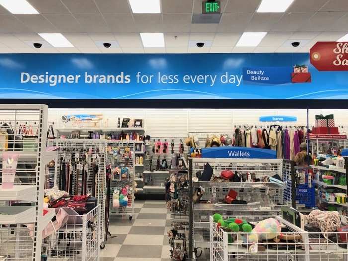 On our right, we saw different items on display beneath a sign that highlighted the option to find designer brands for less.