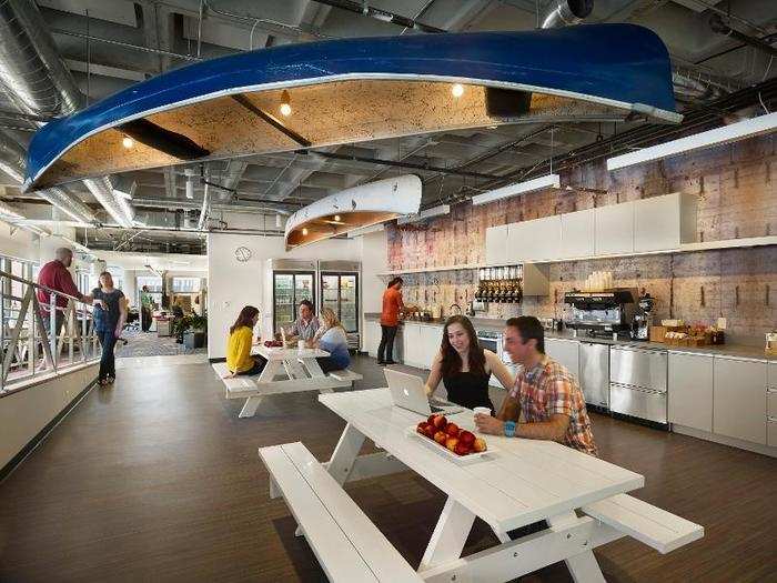 One of several micro-kitchens has canoes hanging from the ceiling, a nod to the popularity of boating on the Charles River that separates the two cities.