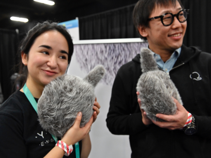 Yukai Engineering showed off Qoobo, a therapy robot that looks like a headless cat and wiggles its tail when you pet it.