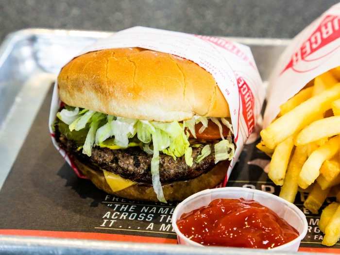 The original Fatburger is a third-pounder patty in a bun with the works — lettuce, tomato, cheese, pickles, onion, mayo, mustard, and relish.