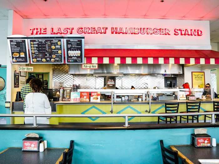 Inside, the restaurant had a charming retro interior with neon lettering and vibrant colors.