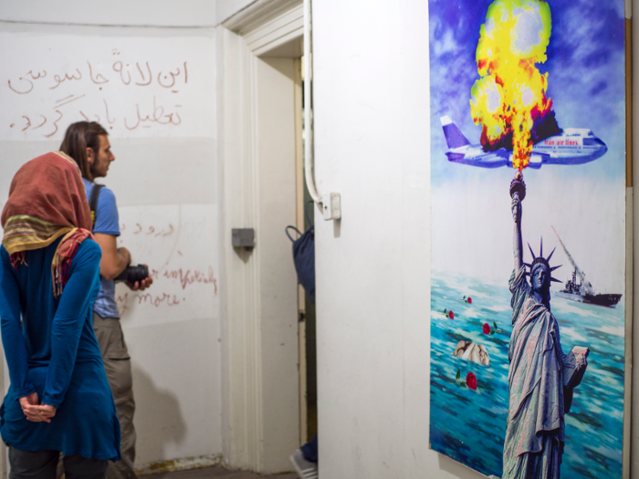 In the years since, the tragic incident has mostly been forgotten in the US. In Iran, it remains an open sore. Here, a poster shows the Statue of Liberty setting the flight on fire.