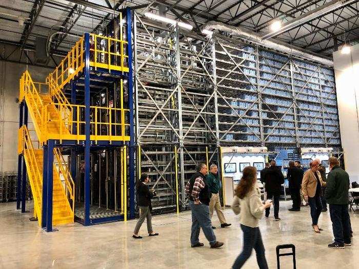 After we watched Alphabot fill orders, a Walmart employee demonstrated how workers stock the system with products.