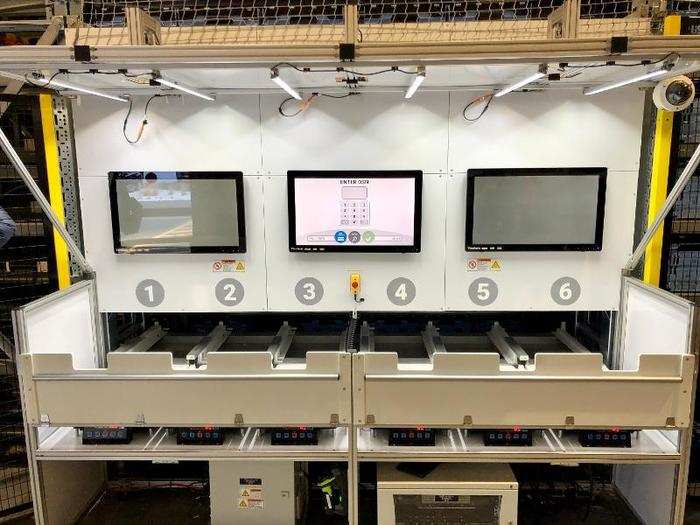 When Walmart customers arrive at the store to pick up their orders, employees use these touch-screen computers to retrieve their groceries.