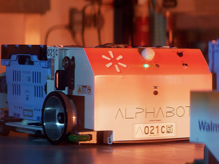 Inside Alphabot, these wheeled robots whir quietly as they move vertically and horizontally along the shelving system, retrieving and depositing bins. The bots are about 2 feet wide by 2.5 feet long.