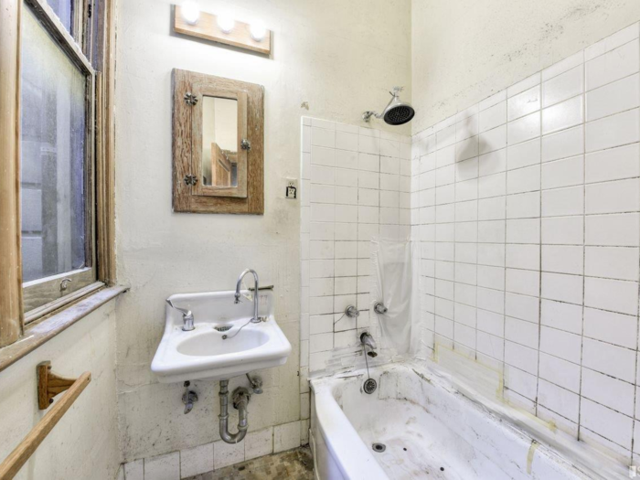 There are also photos of at least two full bathrooms, both of which need quite a lot of work.