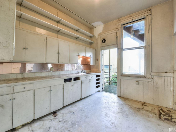 Photos show two different kitchens and multiple rooms that could be used as bedrooms in the house.