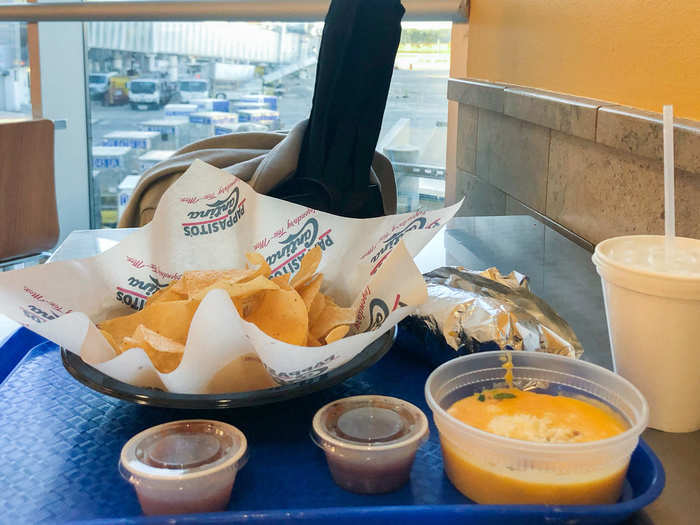 After taking a long walk around the airport to get my blood flowing, I grabbed a taco and some chips and queso near my gate.