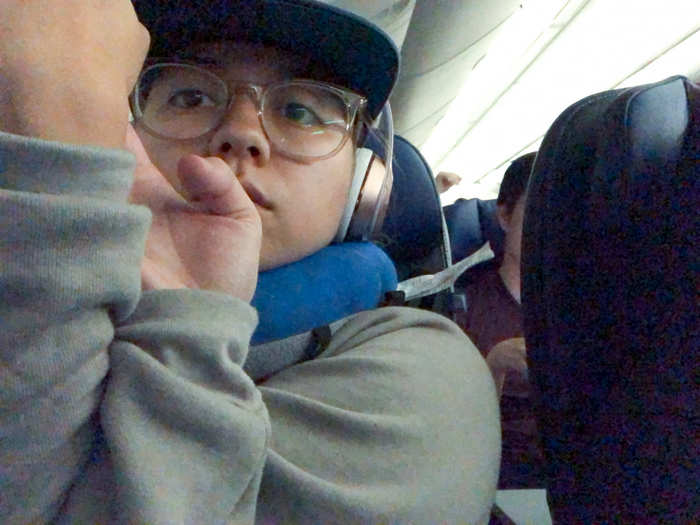 During this flight, I really wanted to get up stretch, but I mistakenly booked another window seat for this viewless flight, and the people sitting next to me seemed to be in deep slumber. So I did some seated yoga poses in my chair.