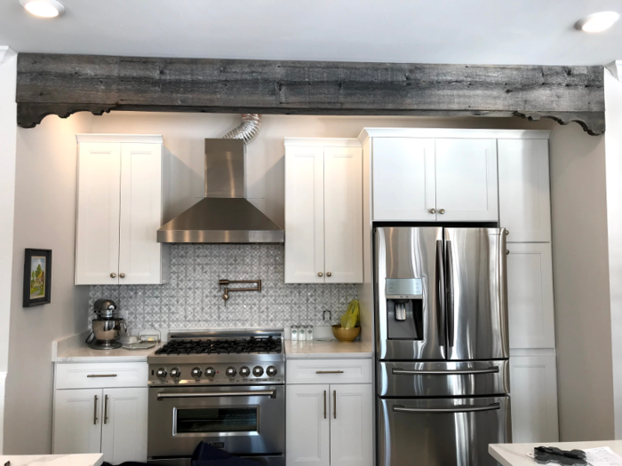 For example, there was a beam centered over the stove where the ventilation hose was supposed to go, forcing them to leave the slinky tube on an angle.