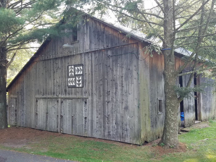 There are six structures on the farm: two small barns, a big barn, a small house, a garage/workshop, and the main house.