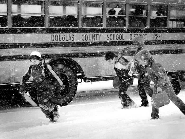 In 1987, a snowstorm closed Douglas County school 90 minutes early. The students ran through falling snow to climb aboard the school bus.