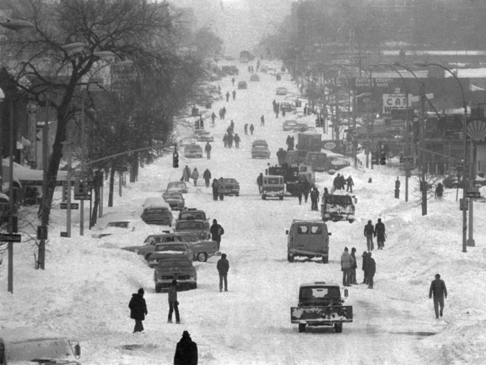 In Queens, New York, a carnival of stalled cars, stranded pedestrians, snow plows and children took over as a blanket of heavy snow transformed a normally congested road into a winter park.