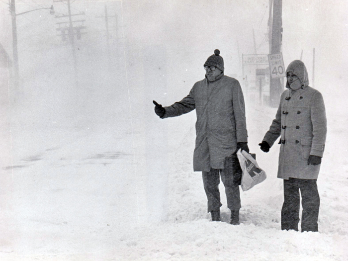 In 1978, two men with hands and heads covered hoped for a ride during a snowstorm in Commack, New York.