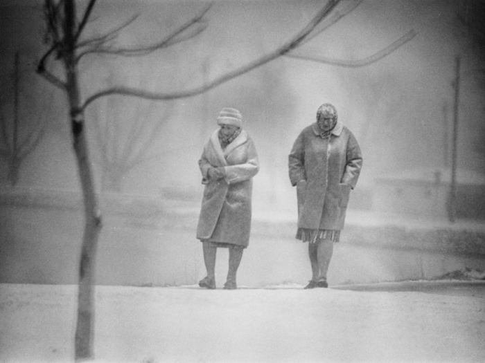 In Denver, two women took a stroll near Cooper Lake as falling snow clung to their coats.