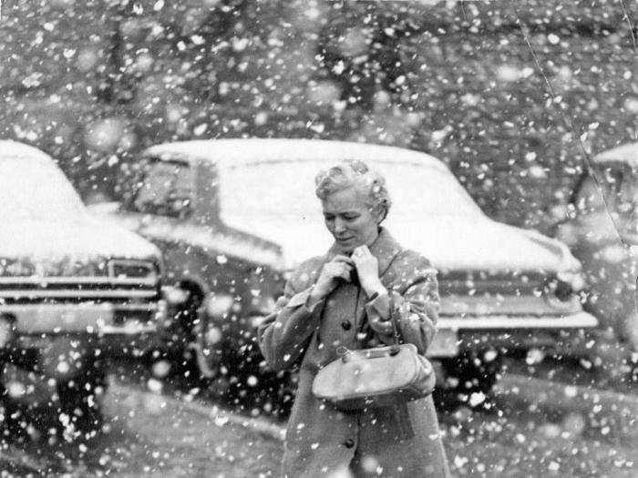 In 1967, a New England woman buckled her collar during a spring snowstorm in Boston.