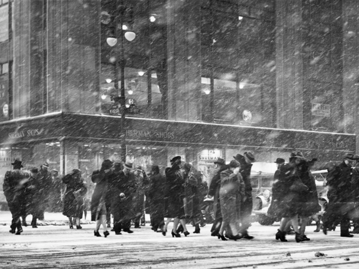 The streets remained busy during a miserable snow storm in the 1950s.