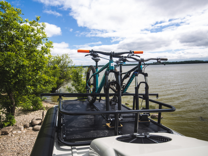 The roof also has a custom safari basket and electric bike rack with a 110-volt charger.