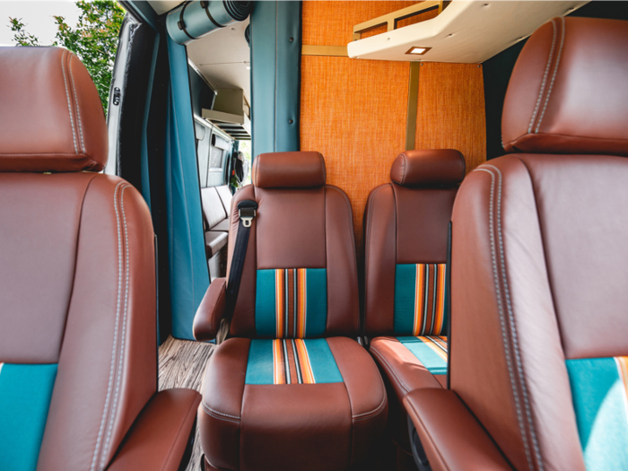 The driver and passenger seats are brown with multicolored detailing panels.