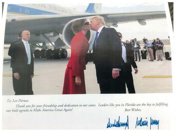 An appreciation card signed by the president and first lady Melania thanks Parnas by name for his "friendship and dedication to our cause."