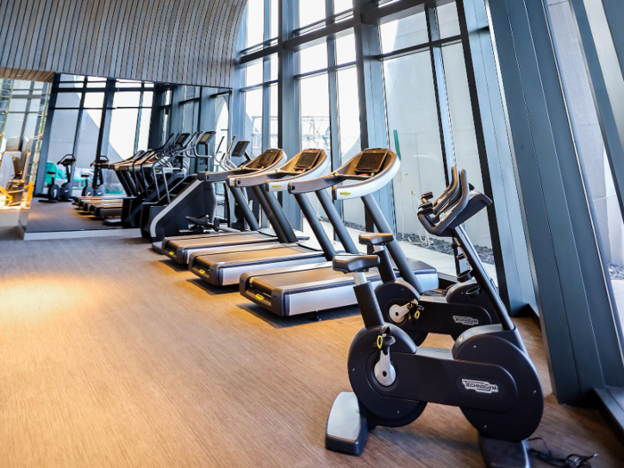 The fitness center comes with strength and cardio training equipment.