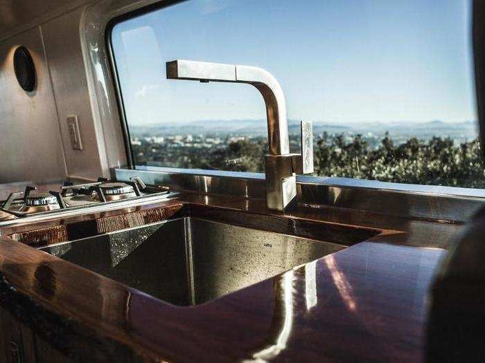 Plumbing capabilities extend to the sink and outdoor shower.