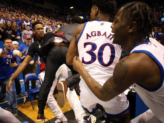 The fight bled into the stands, with spectators dodging punches as the players brawled.