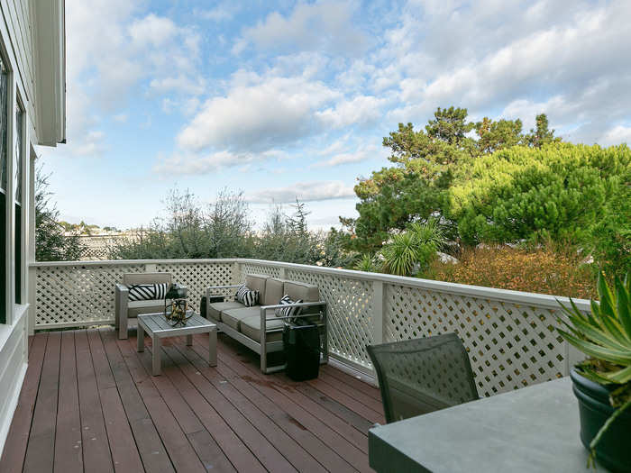 The deck is connected to the main kitchen for seamless indoor and outdoor living.